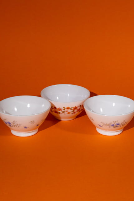 Vintage Arcopal set of three floral pattern bowls