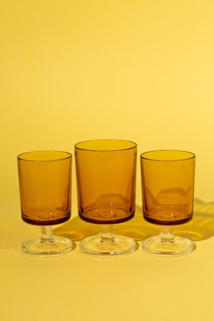 Vintage set of three stemmed amber glasses