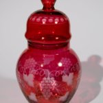 Vintage decorative bottle with vine pattern