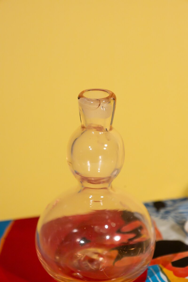 Vintage light pink decorative glass bottle