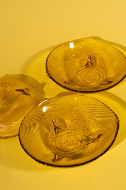 Vintage set of four amber glass bowls